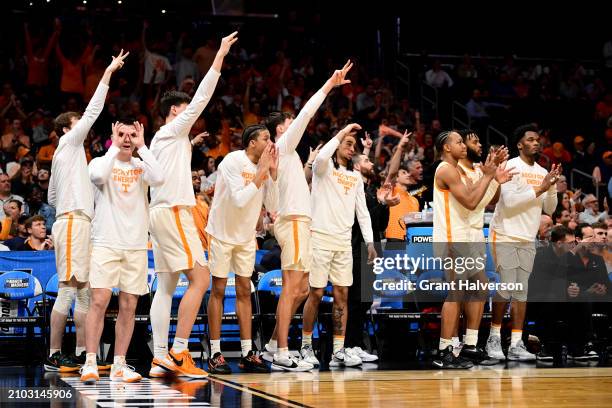 Tennessee Volunteers bench celebrates in the second half during the first round of the NCAA Men's Basketball Tournament against the Saint Peter's...