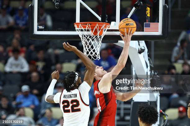 Ben Middlebrooks of the North Carolina State Wolfpack shoots against Warren Washington of the Texas Tech Red Raiders during the second half in the...