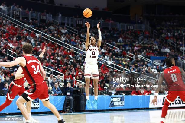 Chance McMillian of the Texas Tech Red Raiders shoots against the North Carolina State Wolfpack during the second half in the first round of the NCAA...