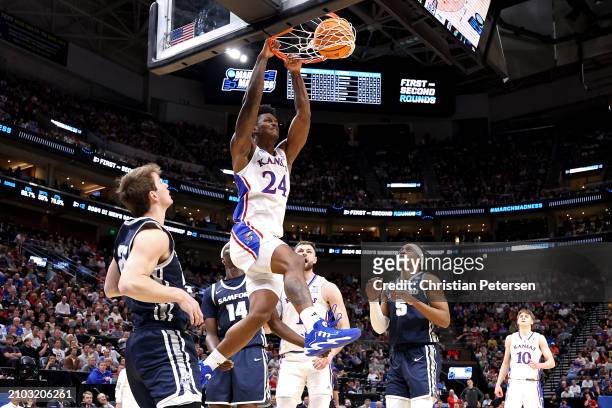 Adams Jr. #24 of the Kansas Jayhawks dunks the ball Samford Bulldogs during the second half in the first round of the NCAA Men's Basketball...