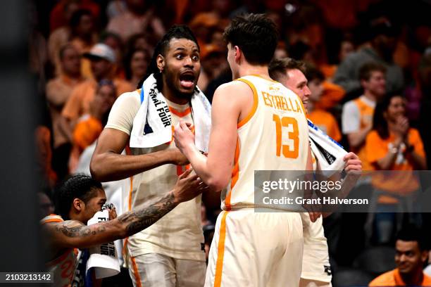Jonas Aidoo of the Tennessee Volunteers reacts to J.P. Estrella in the second half during the first round of the NCAA Men's Basketball Tournament at...
