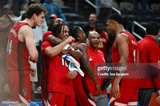 Breon Pass of the North Carolina State Wolfpack celebrates with his teammates after defeating the Texas Tech Red Raiders during the second half in...