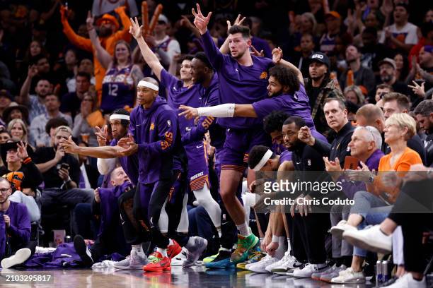 Ish Wainright, Isaiah Thomas, Drew Eubanks and David Roddy of the Phoenix Suns react after a three-point basket by Royce O'Neale during the second...