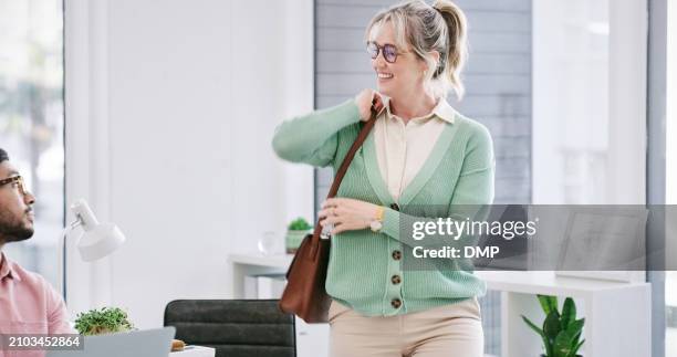 woman, casual and leaving office with purse for going home, departure and finish work for day. mature, female person, colleague and grab bag for workday over, creative career and closing time. - closing time stock pictures, royalty-free photos & images