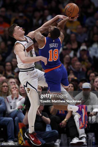 Christian Braun of the Denver Nuggets stops Alec Burks of the New York Knicks during the fourth quarter at Ball Arena on March 21, 2024 in Denver,...