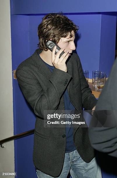 Actor Jamie Bell talks on his cellphone at the Nicholas Nickleby premiere at the Warner Village Cinema West End June 22, 2003 in London, United...