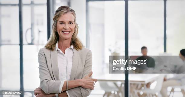 business, confident ceo and portrait of happy woman in office, company or mature executive in workplace for pride. face, manager or professional entrepreneur with arms crossed for career in australia - entrepreneur stockfoto's en -beelden
