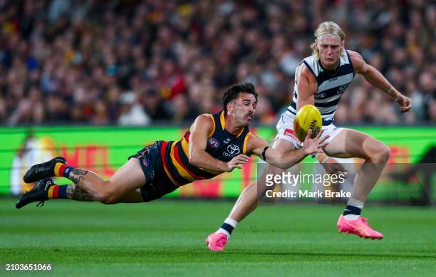 Lachlan Murphy of the Crows competes with Oliver Dempsey of the Cats during the round two AFL match between Adelaide Crows and Geelong Cats at...