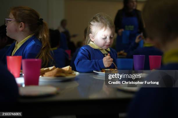 Children at Cherry Fold Primary School's breakfast club enjoy their food before lessons start on March 22, 2024 in Burnley, England. Labour's Shadow...