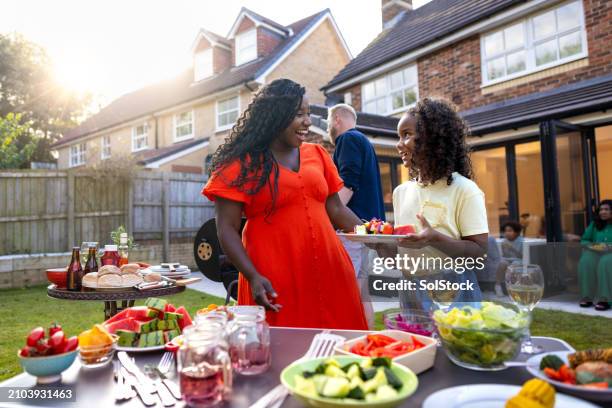bbq food in the sun with family - garden party stock pictures, royalty-free photos & images