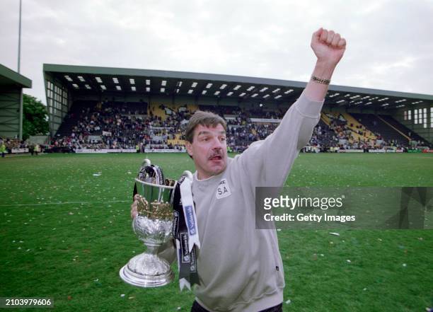 Notts County Manager Sam Allardyce celebrates with the trophy after County had won the Nationwide League Division 3 title after a 5-2 victory over...