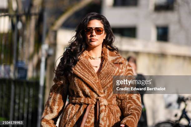 Ashley Graham wears sunglasses, a chain necklace, a fluffy zebra print coat, outside Stella McCartney , during the Womenswear Fall/Winter 2024/2025...