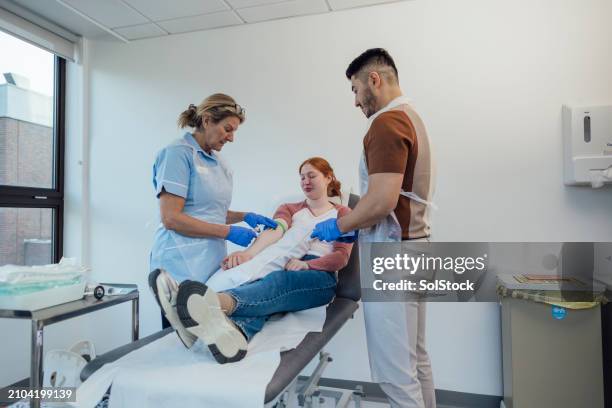 getting blood taken in hospital - medical examination room stock pictures, royalty-free photos & images