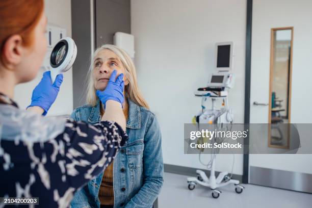 helping hand from the doctor - medical examination room stock pictures, royalty-free photos & images