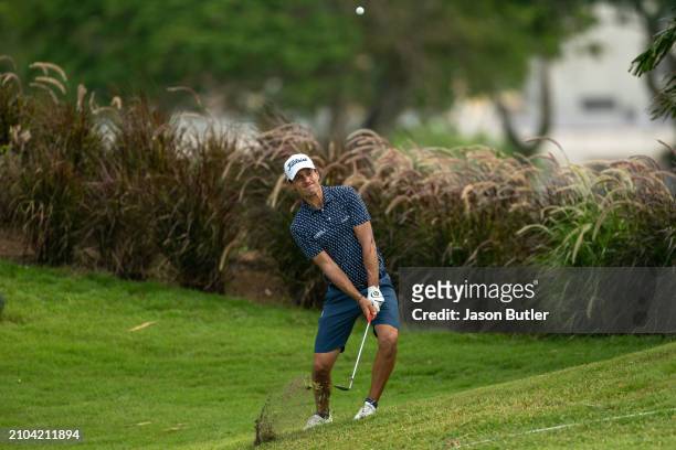 Matteo Manassero of Italy pitches onto the green on hole 14 during Day Two of the Porsche Singapore Classic at Laguna National Golf Resort Club on...