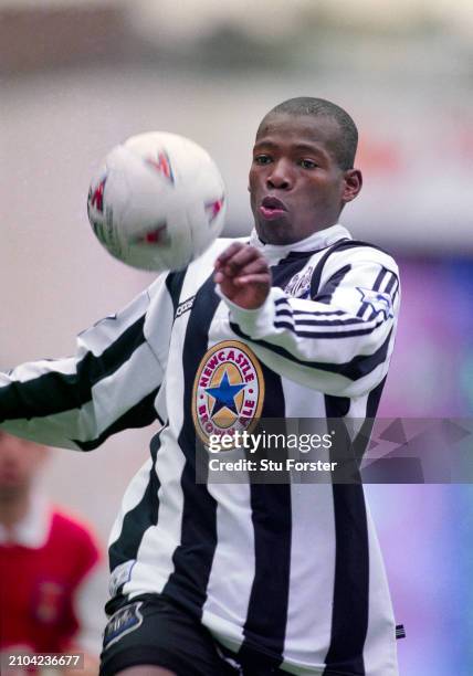 Newcastle United striker Faustino Asprilla in action in the Adidas home shirt with the Brown Ale logo during a Premier League match against Arsenal...