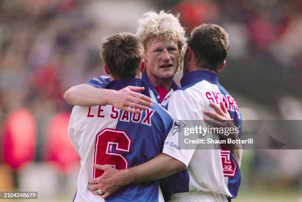 Blackburn Rovers players Graeme Le Saux Colin Hendry and Alan Shearer celebrate winning the FA Premier League after the match between Liverpool and...