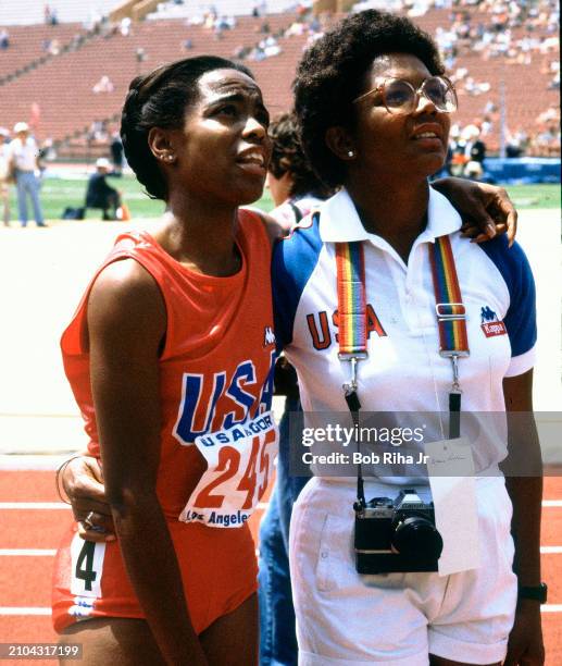 United States Runner Evelyn Ashford watches replay of her race during United States vs East Germany track meet in Los Angeles Coliseum, June 25, 1983...