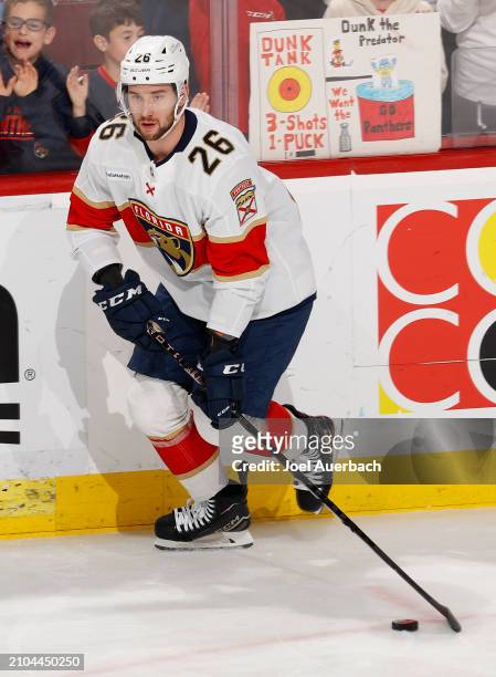 Uvis Balinskis of the Florida Panthers skates with the puck prior to the game against the Nashville Predators at the Amerant Bank Arena on March 21,...
