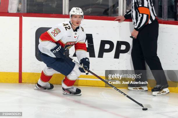 Gustav Forsling of the Florida Panthers skates with the puck against the Nashville Predators at the Amerant Bank Arena on March 21, 2024 in Sunrise,...