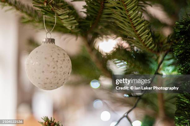 littlebourne, kent, england, uk. 29 december 2022. bauble on christmas tree - wire balls stock pictures, royalty-free photos & images