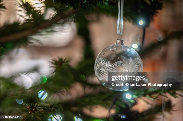 littlebourne, kent, england, uk. 29 december 2022. bauble on christmas tree - wire balls stock pictures, royalty-free photos & images