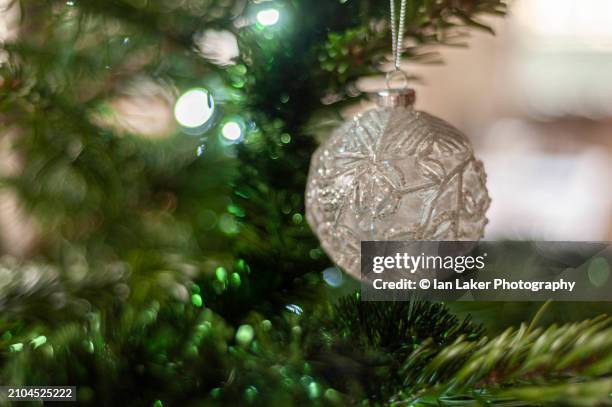 littlebourne, kent, england, uk. 29 december 2022. bauble on christmas tree - wire balls stock pictures, royalty-free photos & images