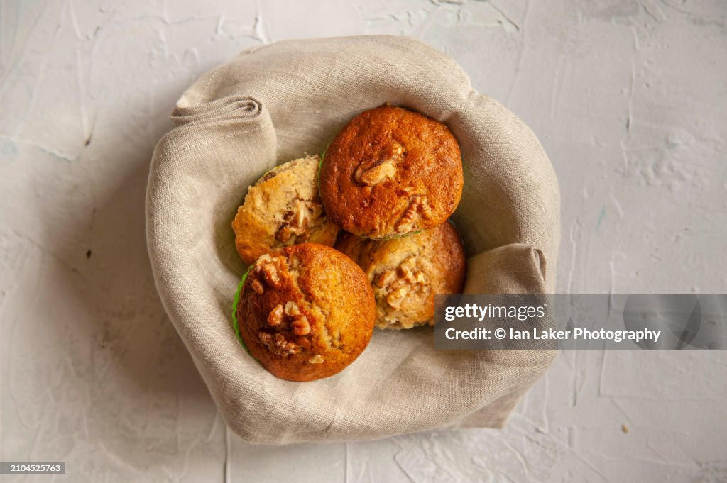 Littlebourne, Kent, England, UK. 22 July 2023. Banana muffins in a napkin lined bowl.