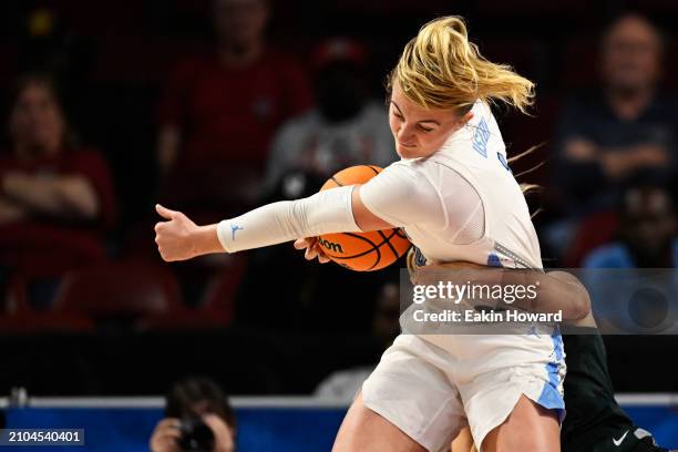 Alyssa Ustby of the North Carolina Tar Heels steals the ball from Tory Ozment of the Michigan State Spartans in the first quarter during the first...