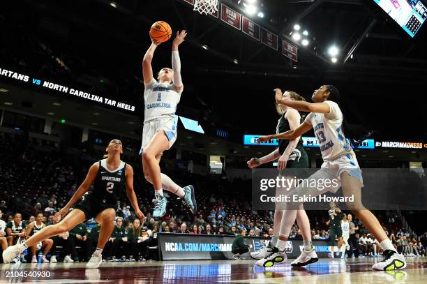 Alyssa Ustby of the North Carolina Tar Heels goes up for a layup against the Michigan State Spartans in the first quarter during the first round of...