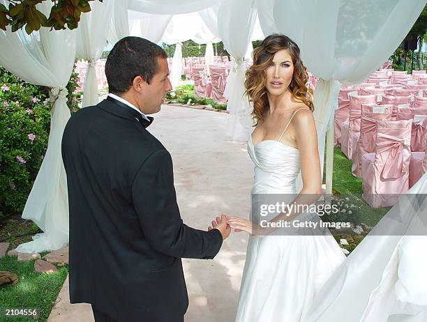 In this handout photo, Adam Sandler poses with his bride model-actress Jackie Titone at their wedding June 22, 2003 in Malibu, California.