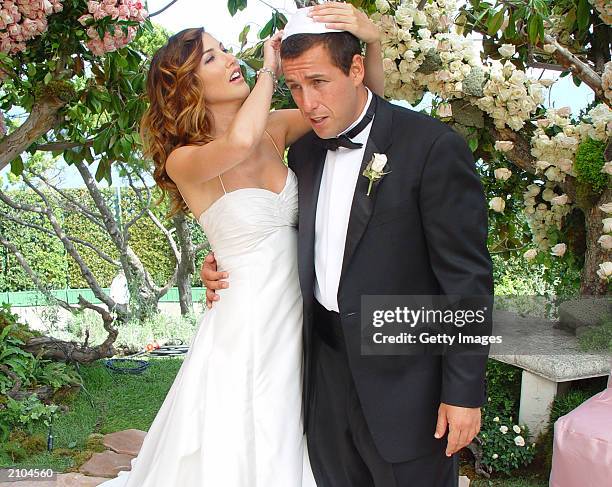 In this handout photo, Adam Sandler poses with his bride model-actress Jackie Titone at their wedding June 22, 2003 in Malibu, California.