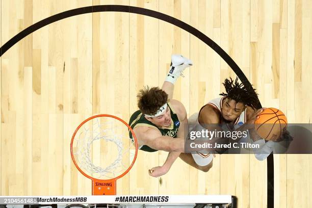 Tyrese Hunter of the Texas Longhorns attempts a lay up during the first half against the Colorado State Rams in the first round of the NCAA Men's...