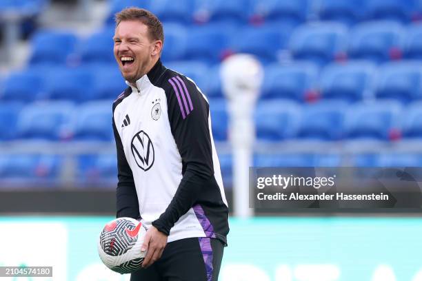 Julian Nagelsmann, head coach of Germany laughs during a training session of team Germany at Groupama Stadium on March 22, 2024 in Lyon, France.