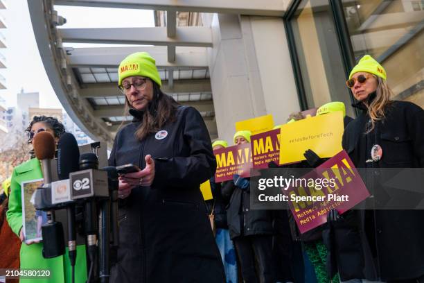 Mary Rodee, whose 15-year-old son Riley died by suicide after falling victim to online bullying on Facebook, joins other members of Mothers Against...