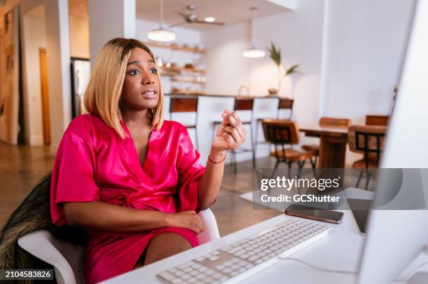 freelancer joins video call, working remotely from home desktop. - social media marketing stock pictures, royalty-free photos & images