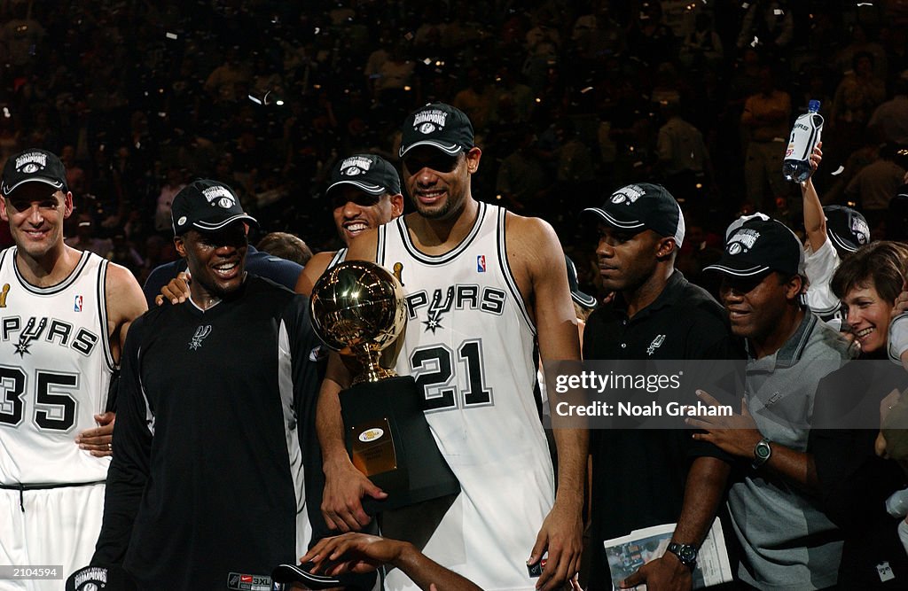 Tim Duncan holds the trophy 