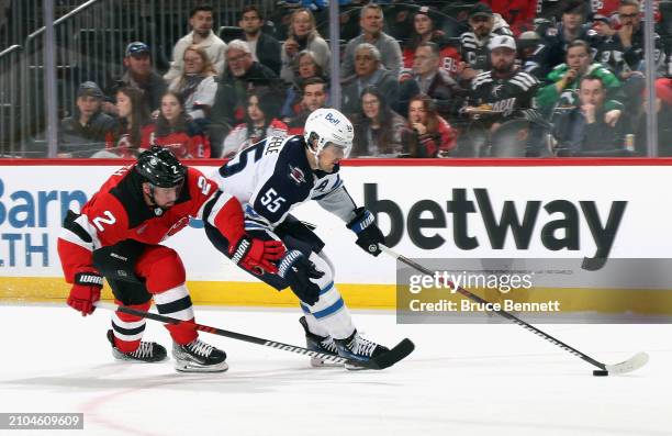 Mark Scheifele of the Winnipeg Jets skates against the New Jersey Devils at Prudential Center on March 21, 2024 in Newark, New Jersey.