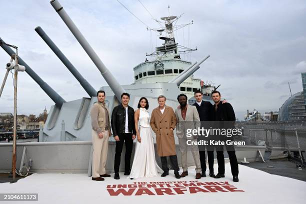 Henry Cavill, Henry Golding, Eiza González, Cary Elwes, Babs Olusanmokun, Hero Fiennes Tiffin and Alex Pettyfer attend the London Photocall For “The...