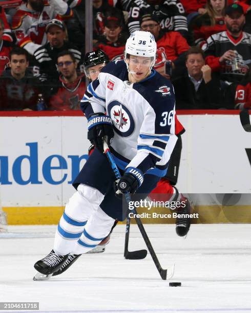 Morgan Barron of the Winnipeg Jets skates against the New Jersey Devils at Prudential Center on March 21, 2024 in Newark, New Jersey.