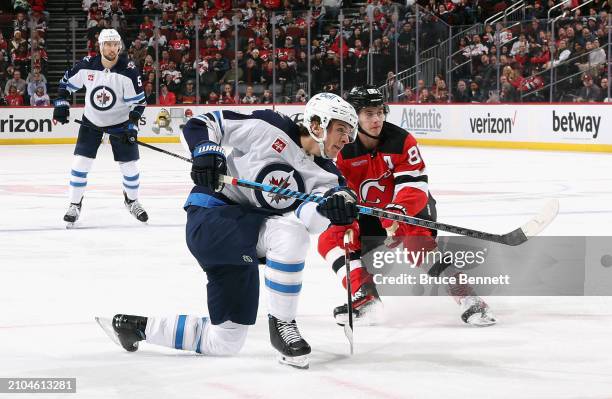 Morgan Barron of the Winnipeg Jets skates against the New Jersey Devils at Prudential Center on March 21, 2024 in Newark, New Jersey.