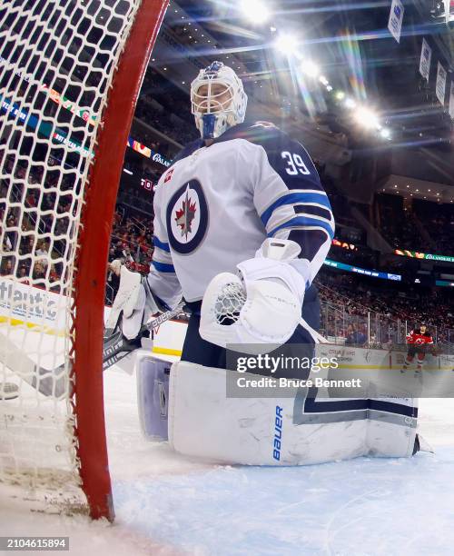 Laurent Brossoit of the Winnipeg Jets skates against the New Jersey Devils at Prudential Center on March 21, 2024 in Newark, New Jersey.