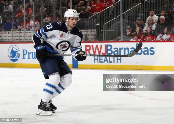 Sean Monahan of the Winnipeg Jets skates against the New Jersey Devils at Prudential Center on March 21, 2024 in Newark, New Jersey.