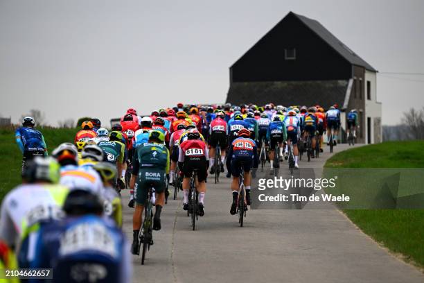 Aime De Gendt of Belgium and Team Cofidis, Amund Grondahl Jansen of Norway and Team Jayco AlUla and a general view of the peloton competing during...