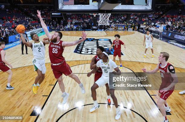 Jayden Nunn of the Baylor Bears shoots over Jeff Woodward of the Colgate Raiders in the first round of the NCAA Men's Basketball Tournament at...