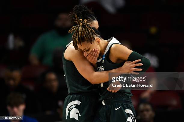 DeeDee Hagemann of the Michigan State Spartans reacts with Moira Joiner after getting fouled by the North Carolina Tar Heels in the third quarter...