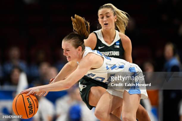 Lexi Donarski of the North Carolina Tar Heels gets fouled by Tory Ozment of the Michigan State Spartans in the fourth quarter during the first round...