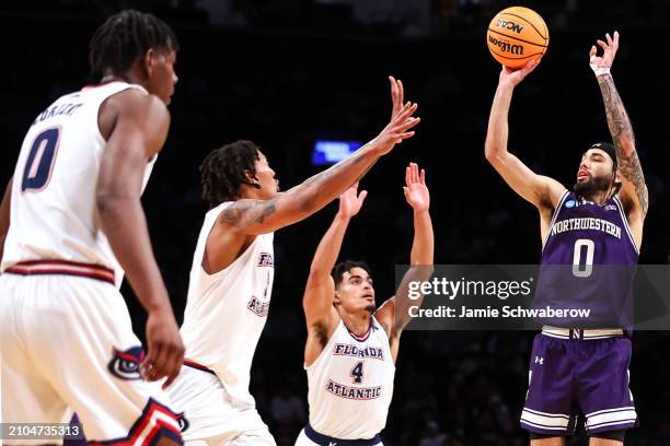 Boo Buie of the Northwestern Wildcats shoots the ball during the second half of the game against the Florida Atlantic Owls during the first round of...