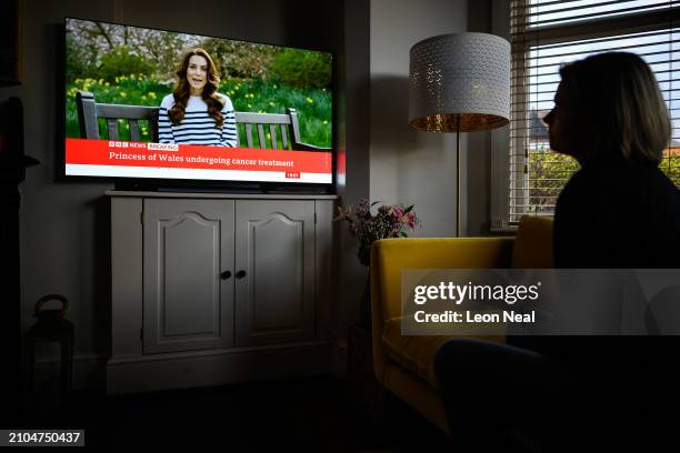 Relative of the Photographer watches television, as Catherine, The Princess of Wales announces that she is receiving a preventative course of...