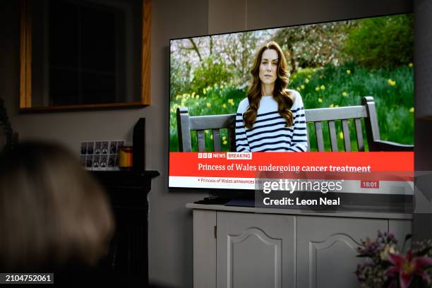 Relative of the Photographer watches television, as Catherine, The Princess of Wales announces that she is receiving a preventative course of...